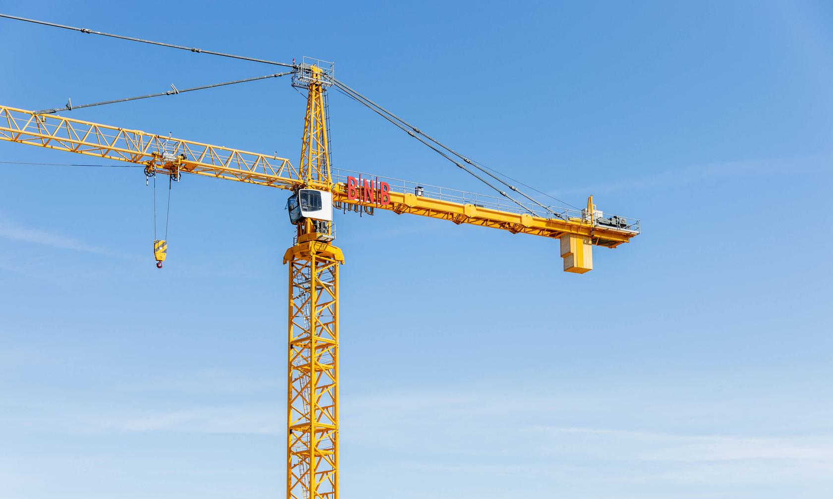 Construction crane with a BNBuilders logo.