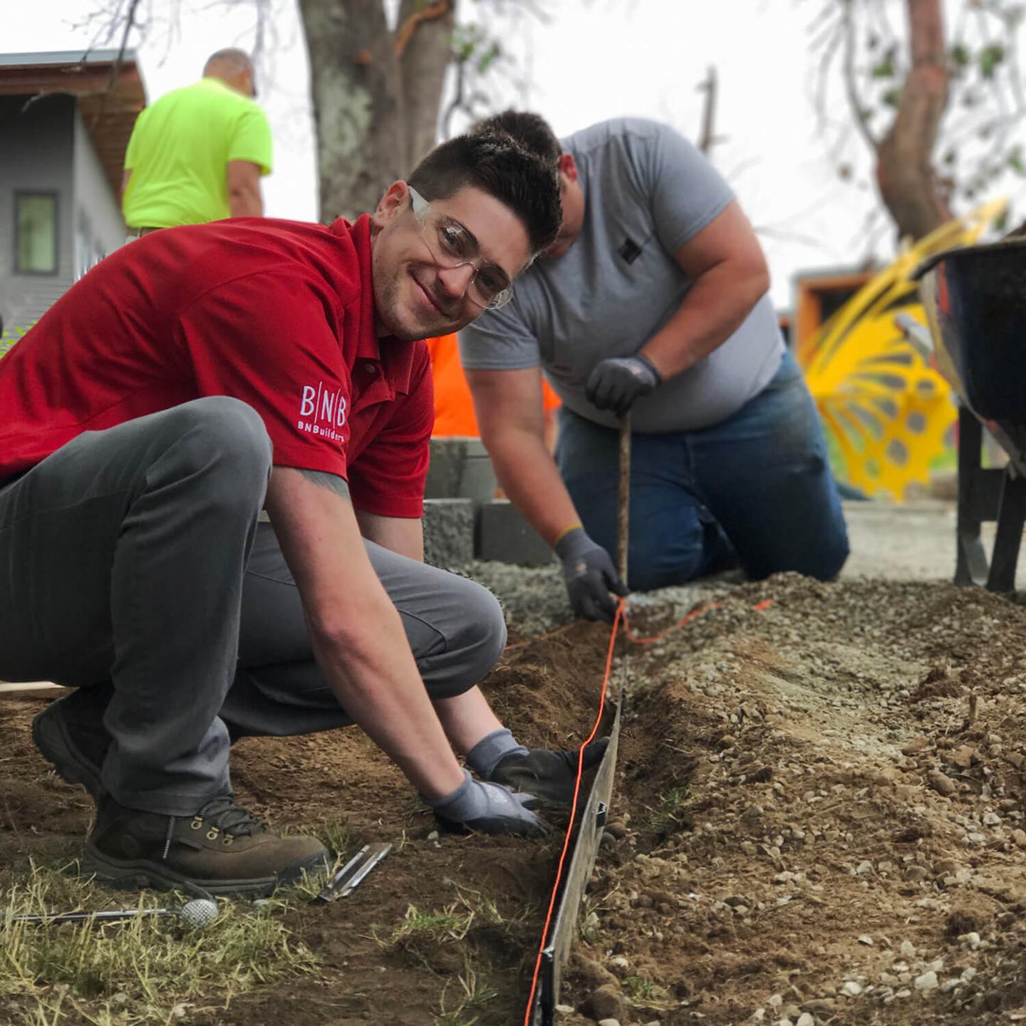 Zak Krein smiling for the camera while working